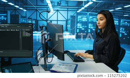 IT engineer in data center using PC to find misconfigurations affecting rackmounts performance. Woman checking servers bottlenecks leading to sluggish data transfer rates and malfunctions 115275202