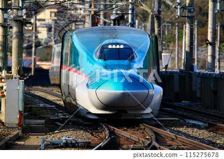 Tohoku Shinkansen bottleneck...E5 series Shinkansen passing through the at-grade intersection at Fukushima Station 115275678
