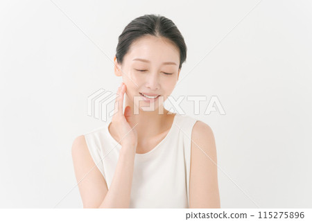 woman smiling with hand on cheek woman smiling with hand on cheek 115275896
