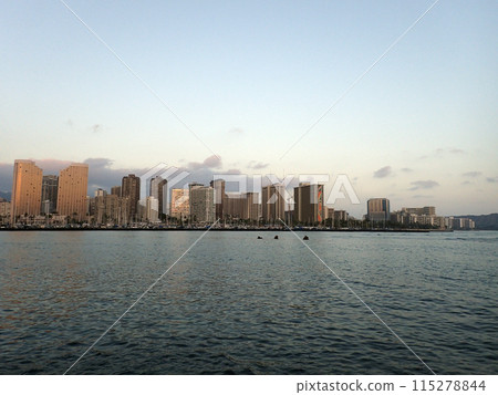 Skyline of Waikiki at sunset or dusk with yachts and boats in Ala Moana harbor 115278844
