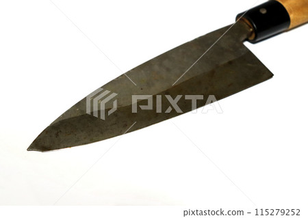 A well-used deba knife on a white background A well-used deba knife on a white background 115279252