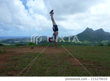 Man Handstands at Pali Highway lookout point 115279810