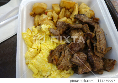 Kiawe grilled steak, scrambled eggs, country fried potatoes 115279997