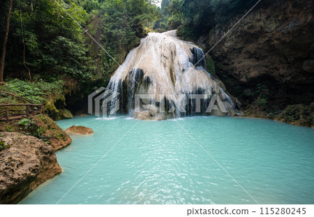 Beautiful view of Koh Luang Waterfall in Maeping National Park of Lamphun province, Thailand. It is a limestone waterfall with spectacular beauty. Beautiful view of Koh Luang Waterfall in Maeping National Park of Lamphun province, Thailand. It is a limestone waterfall with spectacular beauty. 115280245