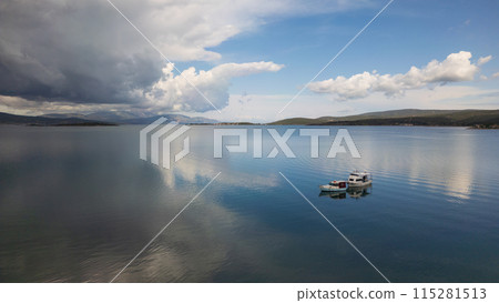 A small boat at beach of Urla, izmir. beautiful clouds 115281513
