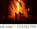 Extinguish the fire. A group of people were putting out a fire in the middle of the night. 115281709