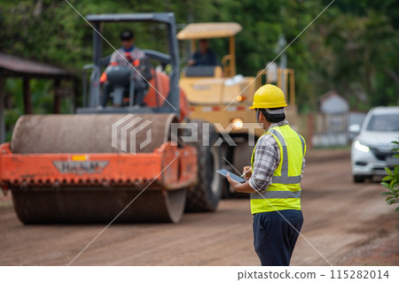 Engineer supervising the construction of asphalt roads Engineer supervising the construction of asphalt roads 115282014