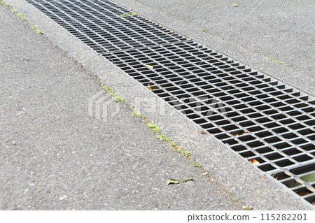 A gutter installed on a road 115282201