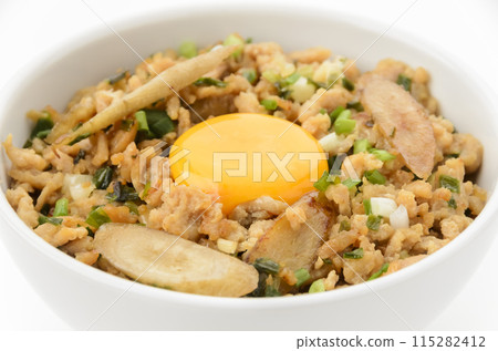 Minced chicken rice bowl with burdock and egg yolk Minced chicken rice bowl with burdock and egg yolk 115282412