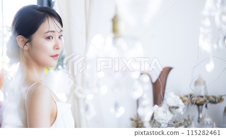 Luxurious woman smiling in a dress - Pre-wedding photo shoot and beauty image 115282461