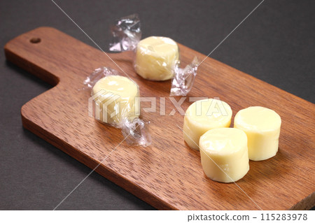 Candy cheese on a cutting board Candy cheese on a cutting board 115283978