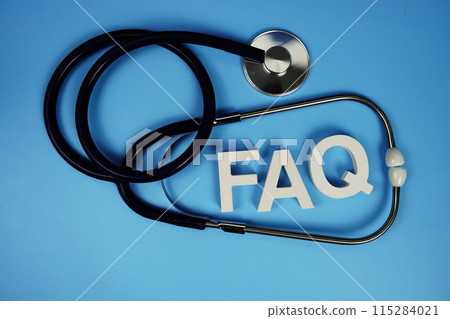 FAQ with wooden blocks alphabet letters and stethoscope on blue background FAQ with wooden blocks alphabet letters and stethoscope on blue background 115284021