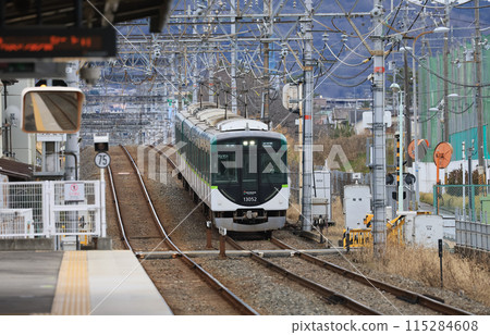 Keihan Katano Line 13000 series train running near Murano Station Keihan Katano Line 13000 series train running near Murano Station 115284608