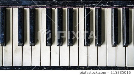 Piano keys background. Old vintage piano for classical music and jazz. Piano keys background. Old vintage piano for classical music and jazz. 115285016
