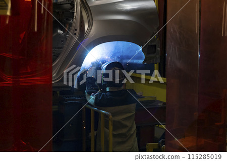 Industrial production of car automobiles. Plant for assembling modern cars on an assembly line. Industry, production, industry concept. Industrial production of car automobiles. Plant for assembling modern cars on an assembly line. Industry, production, industry concept. 115285019