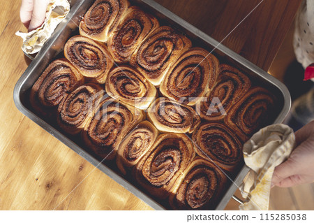 Cinnamon bun roll in plate. Homemade Oven bakery desert for breakfast Cinnamon bun roll in plate. Homemade Oven bakery desert for breakfast 115285038