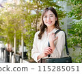 Businesswoman walking outdoors: Career advancement image: Summer sun protection image 115285051