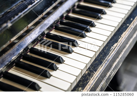 Piano keys background. Old vintage piano for classical music and jazz. Piano keys background. Old vintage piano for classical music and jazz. 115285060