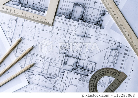 Architectural engineering design plan drawing on the table. Architect's work on table in studio. Construction design and plan 115285068