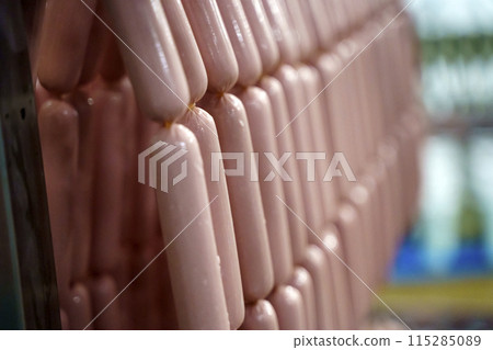 Production of meat sausages. Meat factory and industry. 115285089