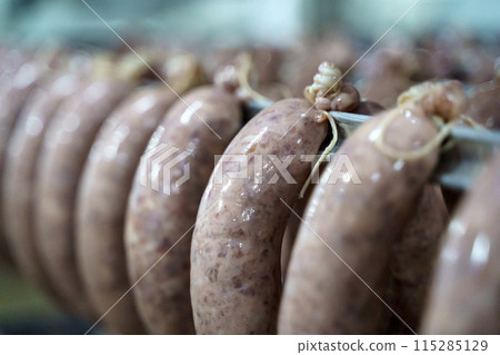 Production of meat sausages and sausages from pork and beef. Meat factory Production of meat sausages and sausages from pork and beef. Meat factory 115285129