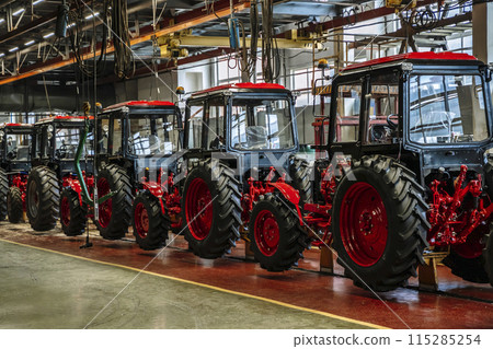 Tractor industry manufacture. New tractors on factory line. Production of agricultural machinery 115285254