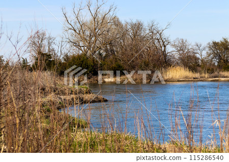 River flowing the Platte river in Nebraska 115286540