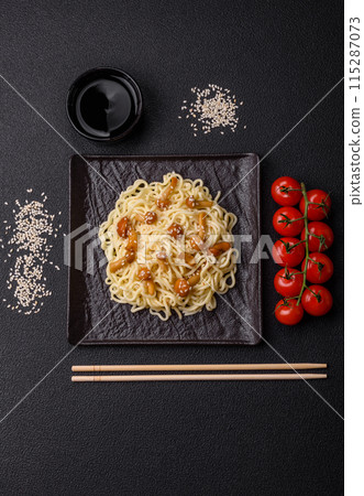 Delicious Asian cuisine dish with rice noodles, peppers, mushrooms and spices 115287073