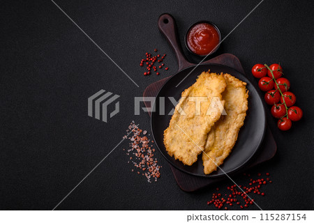 Delicious juicy chicken chops in batter with salt, spices and herbs Delicious juicy chicken chops in batter with salt, spices and herbs 115287154