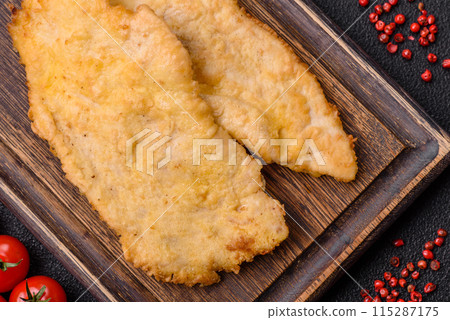 Delicious juicy chicken chops in batter with salt, spices and herbs Delicious juicy chicken chops in batter with salt, spices and herbs 115287175