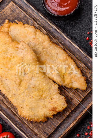 Delicious juicy chicken chops in batter with salt, spices and herbs Delicious juicy chicken chops in batter with salt, spices and herbs 115287176