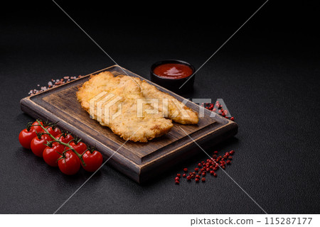 Delicious juicy chicken chops in batter with salt, spices and herbs Delicious juicy chicken chops in batter with salt, spices and herbs 115287177
