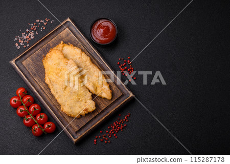 Delicious juicy chicken chops in batter with salt, spices and herbs Delicious juicy chicken chops in batter with salt, spices and herbs 115287178