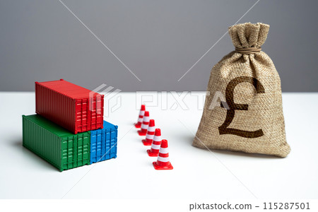 Shipping containers with goods and british pound sterling money bag are separated by a barrier. Break a trade deal. Economic sanctions. Naval blockade. Logistics difficulties. Shipping containers with goods and british pound sterling money bag are separated by a barrier. Break a trade deal. Economic sanctions. Naval blockade. Logistics difficulties. 115287501