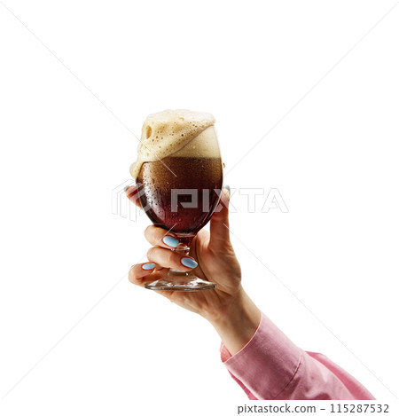 After work refreshment. Female hand holding chill frothy drink, fresh dark beer isolated on white background 115287532