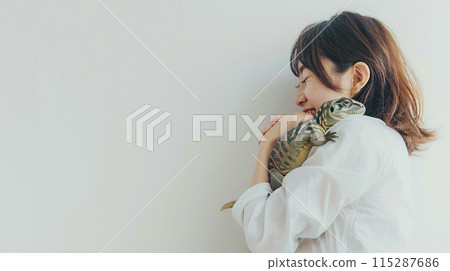 Gentle Girl Hugging Her Dinosaur 115287686