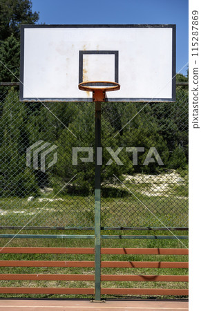 basketball hoop in an outdoor court basketball hoop in an outdoor court 115287869