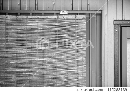 Blinds hung on the windows to keep out the heat Blinds hung on the windows to keep out the heat 115288189