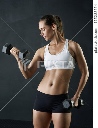 Fitness, woman or dumbbells in studio for arm exercise, training or muscle, challenge or body transformation on black background. Gym, sport or athlete weightlifting for wellness, workout or progress 115288254