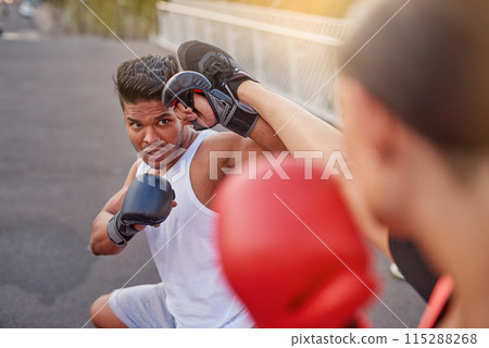 Kickboxing, fight and people training in city for fitness, workout or martial arts man on street for body health. Combat sport, gloves and coach outdoor on road for exercise, wellness and challenge 115288268