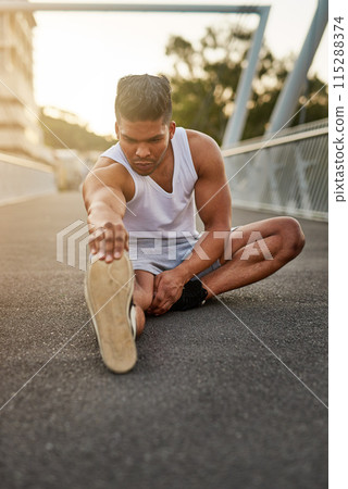 Exercise, man and outdoor stretching legs ready for workout, fitness and running or wellness. Strong, male person or athlete on road for cardio, performance and training or healthy summer body 115288374
