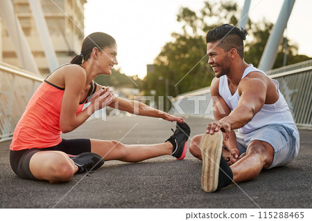 Smile, exercise and couple stretch on bridge for health, wellness or warmup for run. Man, woman and training on road for cardio, preparation and fitness together in city for marathon, jog or sprint 115288465