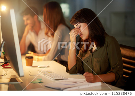 Woman, copywriter and headache in working late, burnout and tired in office with coworkers, desktop and notebook. Female person, creative and fatigue on tech for deadline, publication or magazine Woman, copywriter and headache in working late, burnout and tired in office with coworkers, desktop and notebook. Female person, creative and fatigue on tech for deadline, publication or magazine 115288476