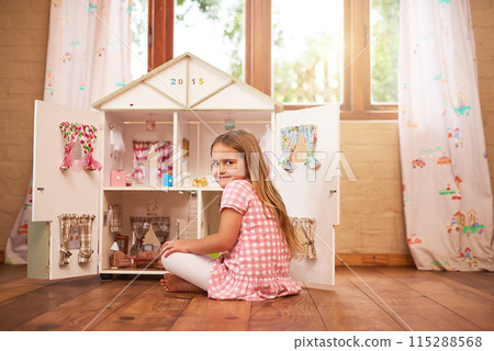 Portrait, girl and dollhouse in bedroom for happiness, play and childhood development on holiday in home. Smile, female child and having fun on floor for creativity, education and toys for vacation 115288568