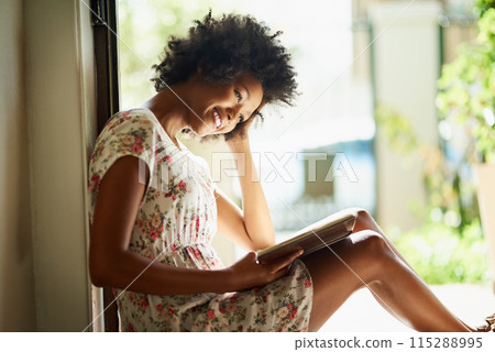 Woman, reading and book in home or happy, door way and sitting on floor for comfort with literature or novel for hobby. Fiction, fantasy and knowledge or information on weekend, apartment and relax Woman, reading and book in home or happy, door way and sitting on floor for comfort with literature or novel for hobby. Fiction, fantasy and knowledge or information on weekend, apartment and relax 115288995