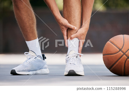 Legs, pain and sport injury with basketball and athlete on basketball court outdoor with emergency and fitness. Basketball player hurt, shoes and exercise with accident during match and workout. Legs, pain and sport injury with basketball and athlete on basketball court outdoor with emergency and fitness. Basketball player hurt, shoes and exercise with accident during match and workout. 115288996