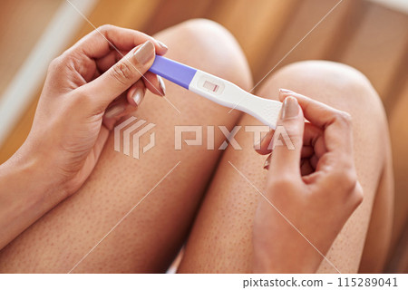 Woman, hands and pregnancy test with negative line on stick for examination or results at home. Closeup of female person waiting in motherhood with maternity exam for impregnation sign or expectation Woman, hands and pregnancy test with negative line on stick for examination or results at home. Closeup of female person waiting in motherhood with maternity exam for impregnation sign or expectation 115289041