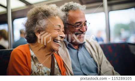 Cheerful mature couple travelling by train, responsible travel concept 115289105