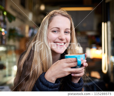 Portrait, laughing or happy woman with coffee in cafe to relax, chill and enjoy warm beverage in Germany. Cappuccino latte, smile or face of girl on break with tea, caffeine or hot chocolate in diner Portrait, laughing or happy woman with coffee in cafe to relax, chill and enjoy warm beverage in Germany. Cappuccino latte, smile or face of girl on break with tea, caffeine or hot chocolate in diner 115289373