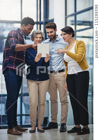 Tablet, group and business people in lobby for advice, online agenda or schedule for planning. Manager, men and women in office on digital app for consulting, opinion and teamwork at creative agency 115289398